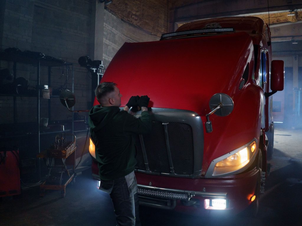 Heavy vehicle mechanic servicing a truck inside a Maryborough workshop