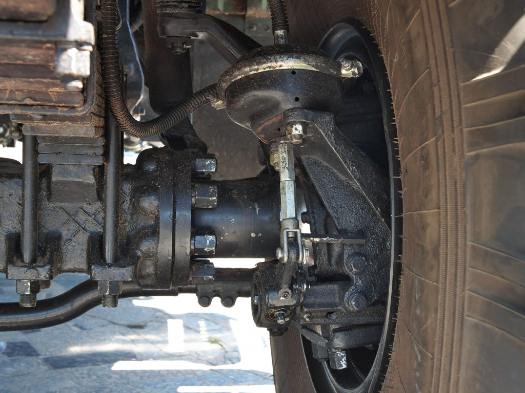 Undercarriage view of a heavy vehicle during inspection