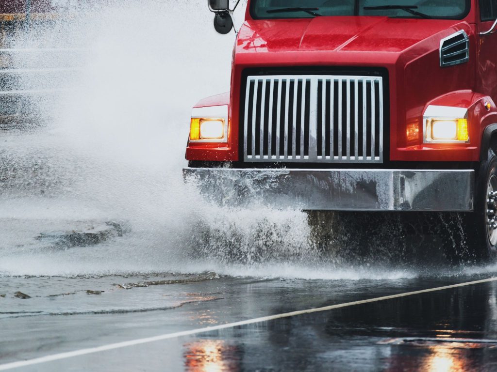 Heavy trucks undergoing wet season vehicle maintenance in Maryborough to ensure safe operation during storms.