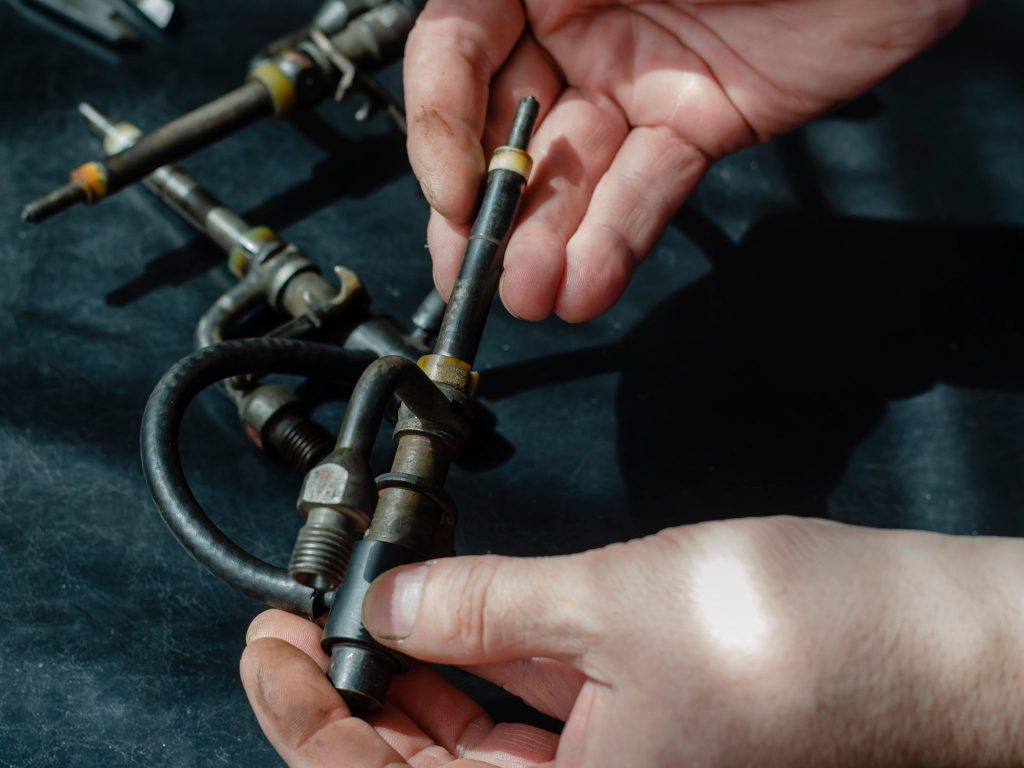 Close-up view of clean diesel injector components after professional servicing.