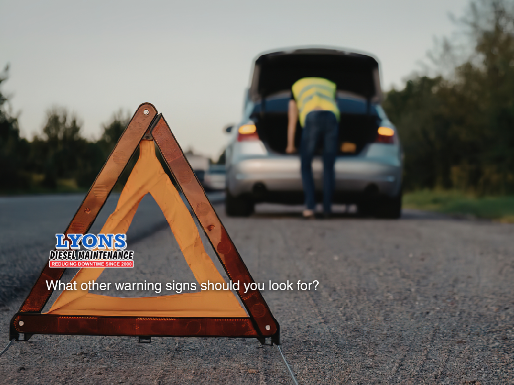Emergency warning triangle placed behind broken down vehicle on roadside due to mechanical engine issue