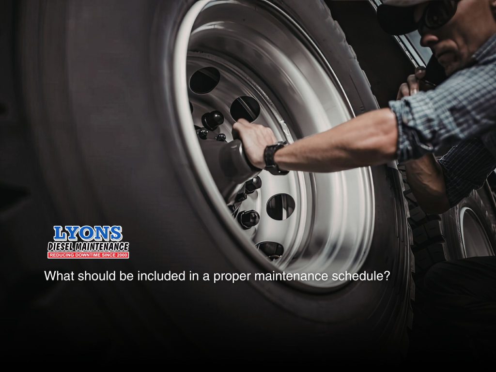 A fleet mechanic working on the truck wheels in Maryborough